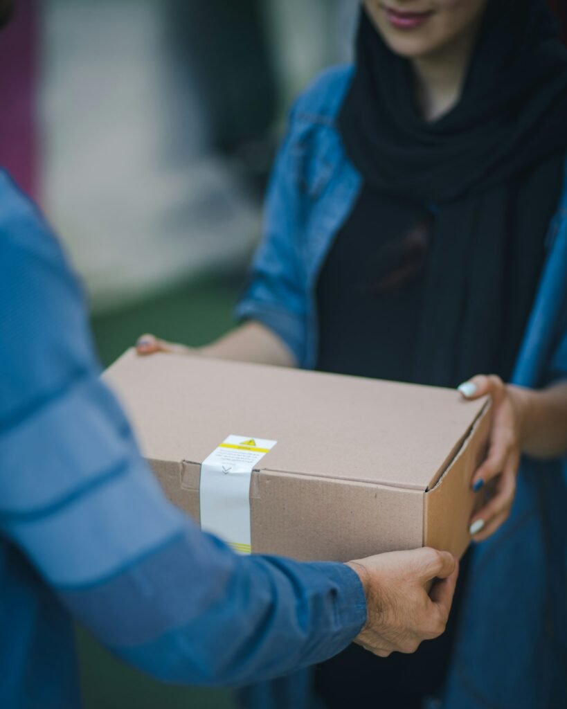 Courier handing over a parcel for free pickup and delivery