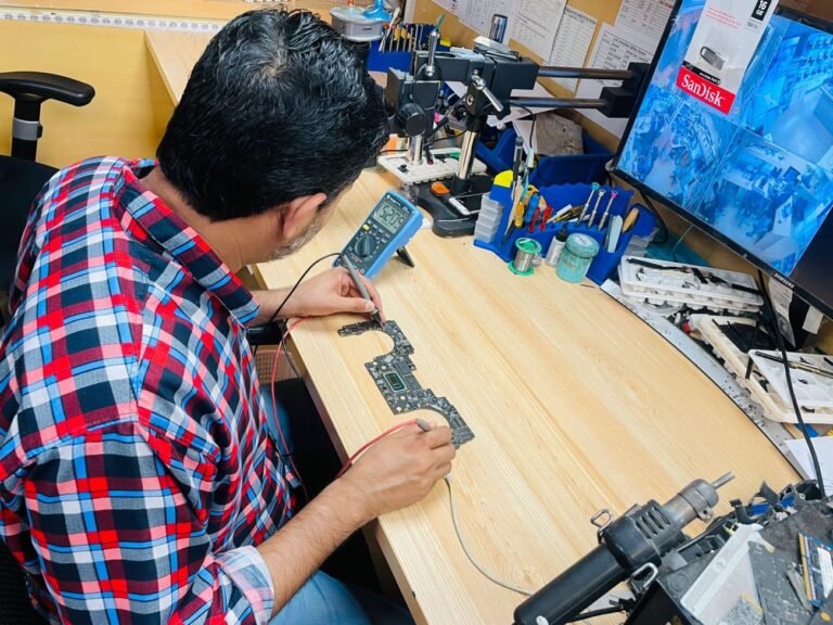 Testing a MacBook logic board with a multimeter